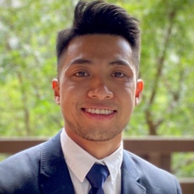 Quang Nguyen wearing a suit and tie